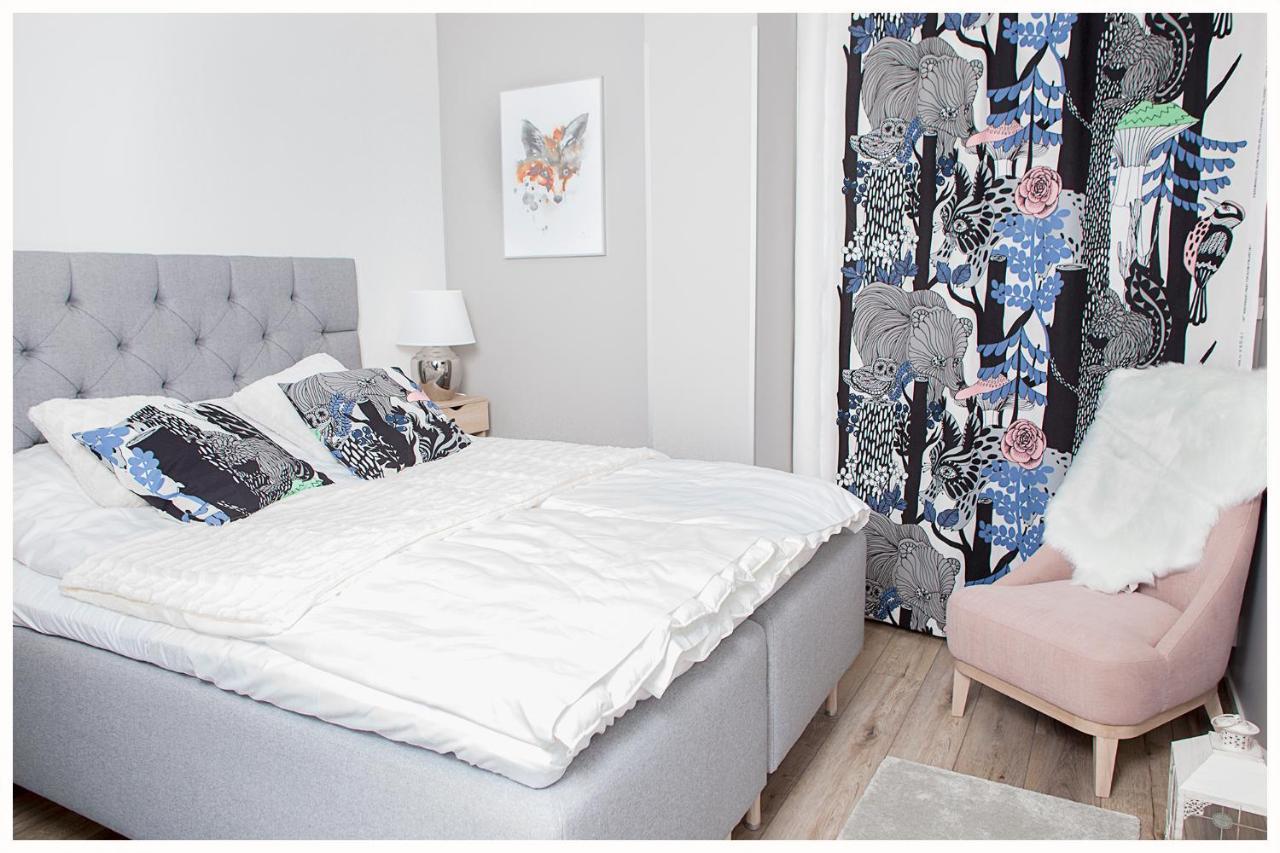 Crystal Arctic Suites Rovaniemi Extérieur photo Bedroom with a bed and a chair